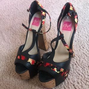 Black flowered shoes with a cork heel